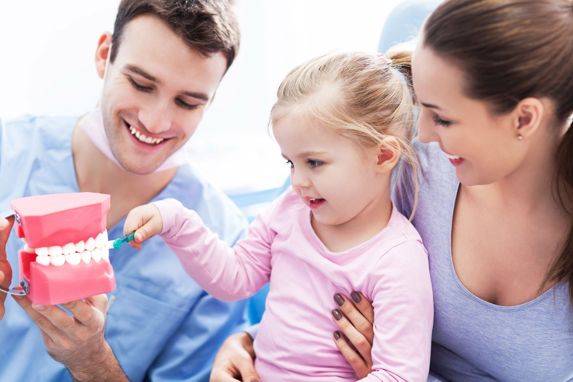 child at the dentist office learning about teeth